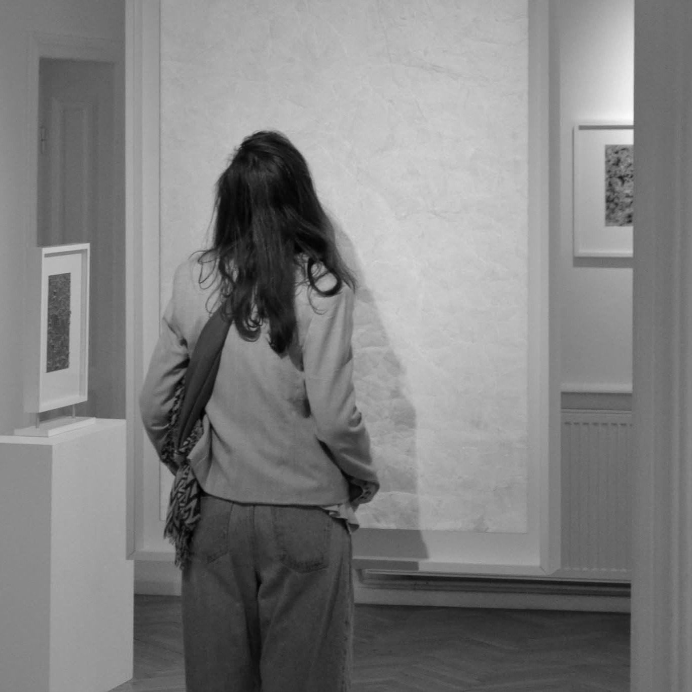 Visitor looking at art in a gallery